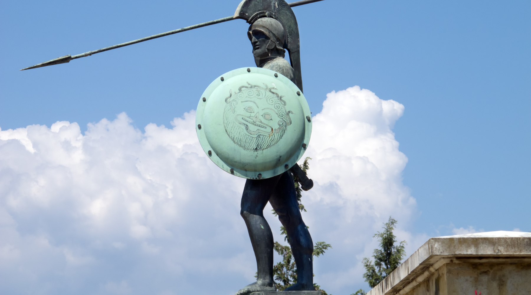 bronze statue holding copper shield